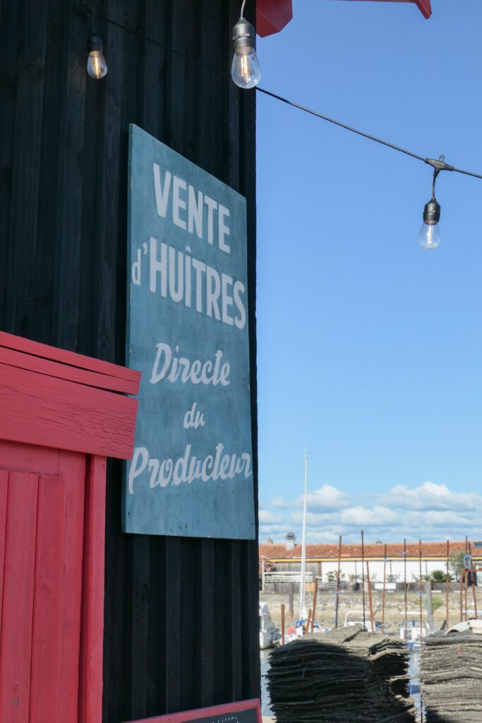 Panneau de devanture de la Cabane 164 au port de La Teste-de-Buch.